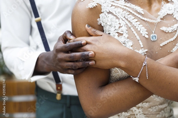 Fototapeta wedding of Africans, hands of the groom