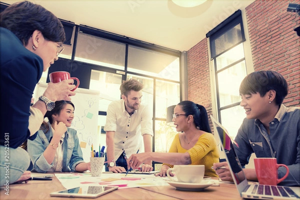 Fototapeta Multi ethnic business person group in casual suit discuss about internal meeting project in modern office. Project and Business concept.