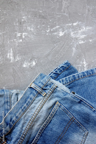 Obraz blue denim on gray concrete background