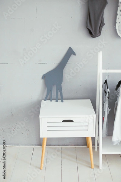 Obraz A giraffe toy on a white bedside table