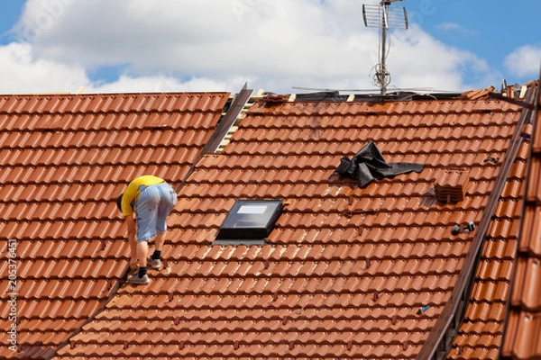 Fototapeta Worker on the roof