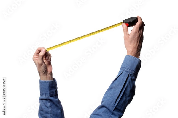 Fototapeta man's hand holding a tape measure on white background with clipping path and copy space