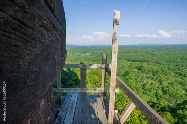 Fototapeta Beautiful scenery of  wooden pathway along the cliff with blue sky background, Phu Thok, Bueng Kan, Thailand