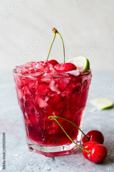 Fototapeta Cherry Margarita Cocktail with Tequila, Lime, Salt, Cherry Juice and Crushed Ice.