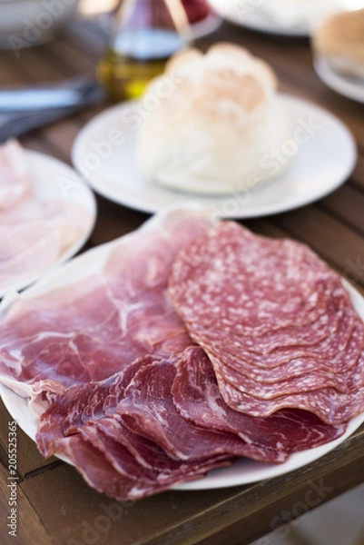 Fototapeta plate with different cold cuts on a table