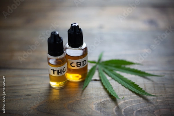 Fototapeta Medicinal cannabis with extract oil in a bottle