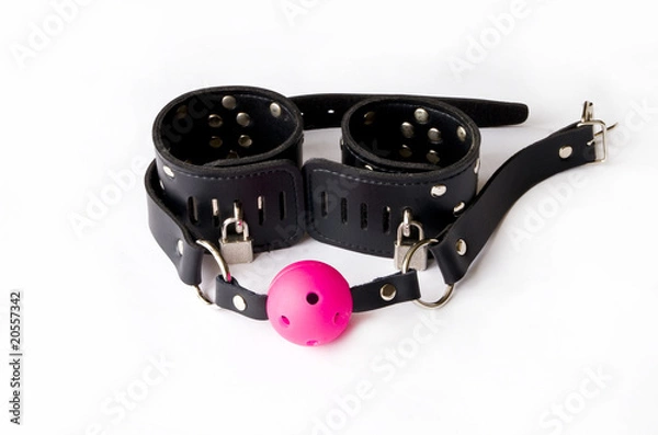 Obraz Gag and leather handcuffs.