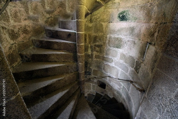 Obraz Old stone spiral staircase going up the inside of a castle tower.