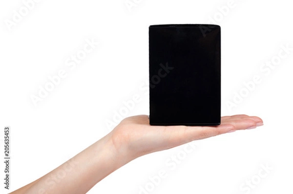 Fototapeta Black gift box with hand isolated on white background