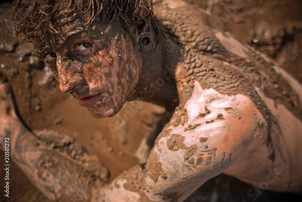 Fototapeta young guy full with mud