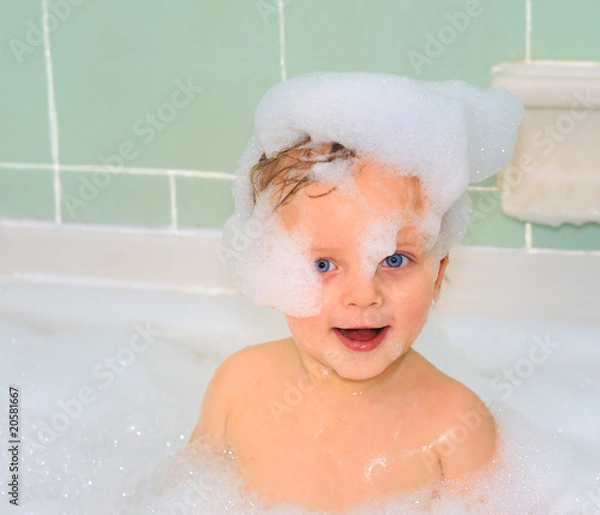 Obraz Cute little baby boy is taking a foam bath