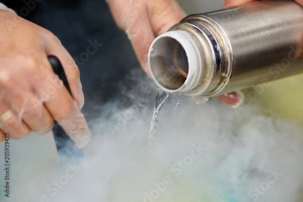Obraz Chef is cooking ice cream with liquid nitrogen