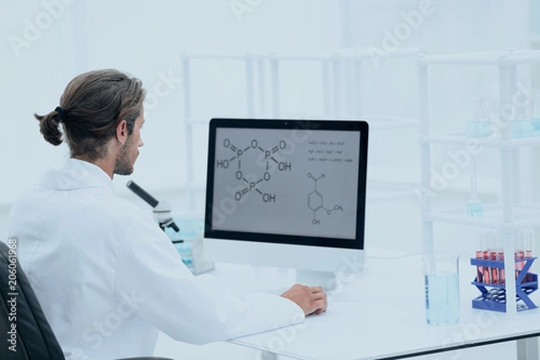 Fototapeta research scientist using computer chemistry laboratory