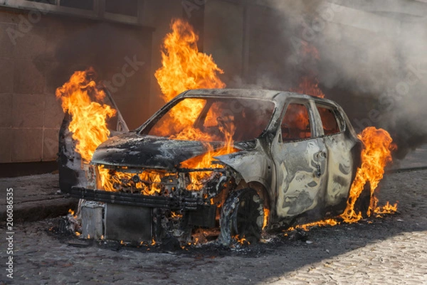 Fototapeta Fire engulfing a car 