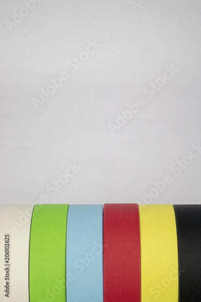 Obraz Bright colorful tape rolls in a pattern on an isolated white background with room for text and other objects! 