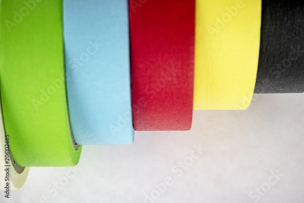 Obraz Bright colorful tape rolls in a pattern on an isolated white background with room for text and other objects! 