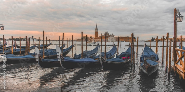 Fototapeta ondolas moored by Saint Mark square with San Giorgio di Maggiore church in Venice