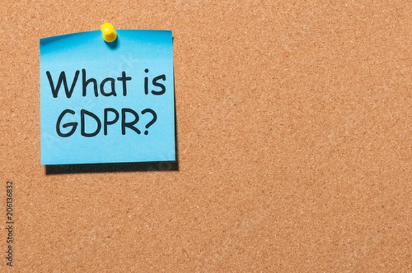Fototapeta What is General Data Protection Regulation or GDPR - note at blue paper pinned to office cork board with copy space for text, template or mock-up