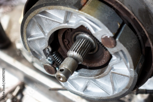 Obraz Old motorcycle drum brake pad in opened engine box