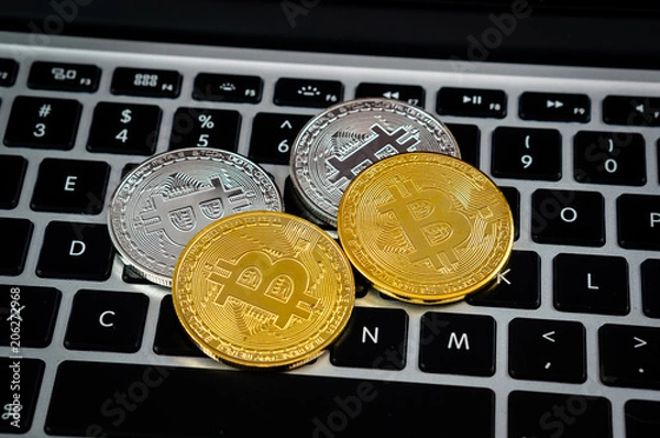 Fototapeta Bitcoin currency and computer keyboard