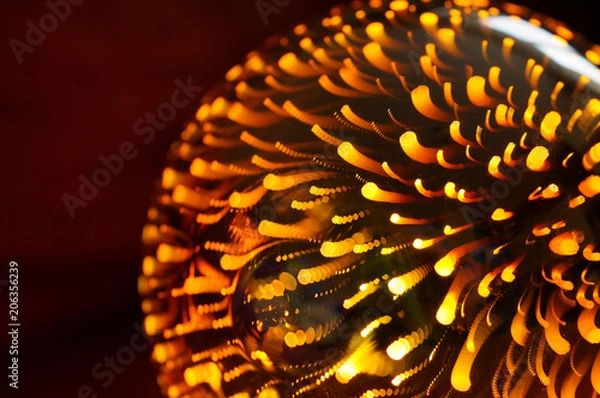 Obraz Shining light bulb with firework effect. Abstract background, closeup photo