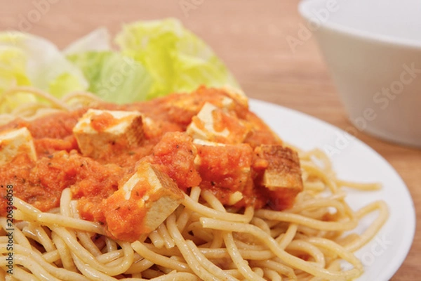 Obraz Bolognese spaghetti with tofu on a table