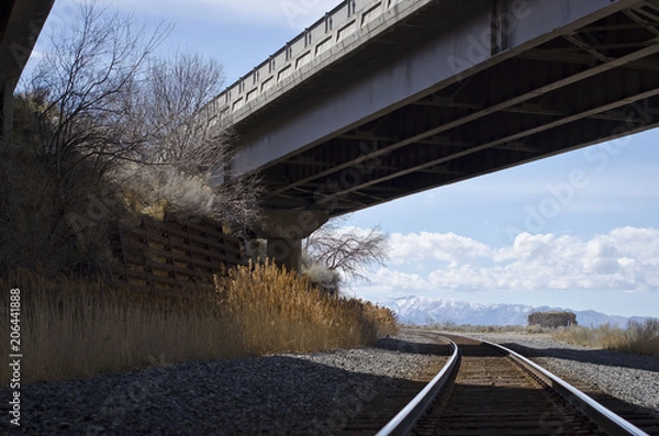Obraz The railroad going under the highway bridge