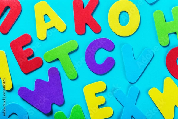 Fototapeta letters of the alphabet in different colors on a blue background