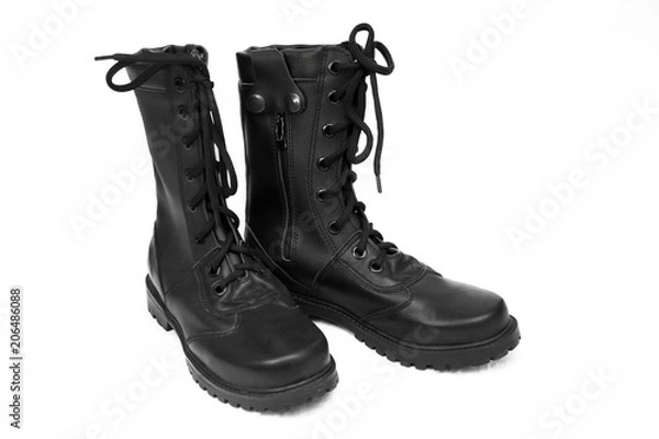 Fototapeta military boots black on the lock and with rivets, sole with a pattern, legs for protection of legs