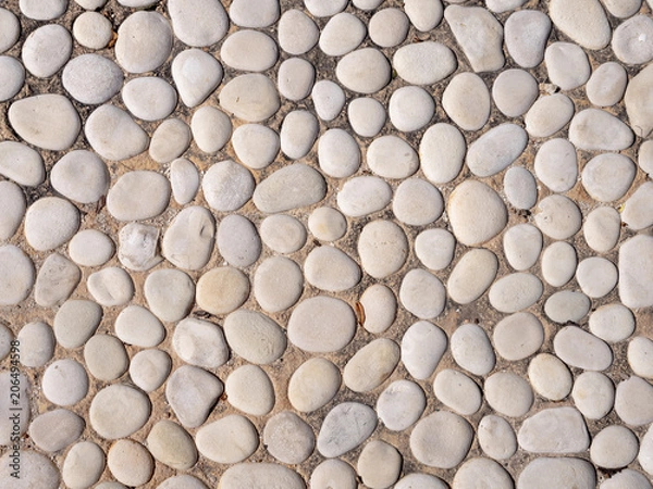 Obraz Paving from sea pebbles. Background, texture
