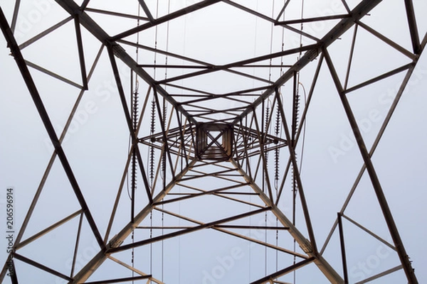 Fototapeta electricity tower overhead power line transmission tower on background blue sky.