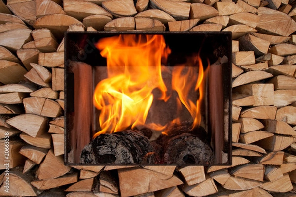 Obraz Holzstapel mit Kaminfeuer