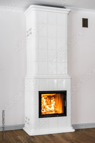 Obraz Bright tiled stove with fire