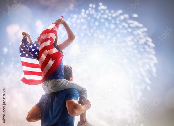 Obraz Osoby trzymające flagę USA.