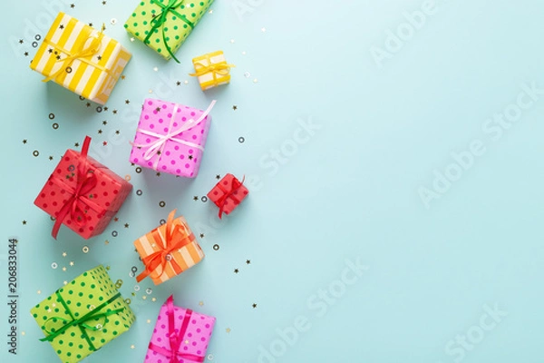 Obraz Holiday flat lay with colorful gift boxes.