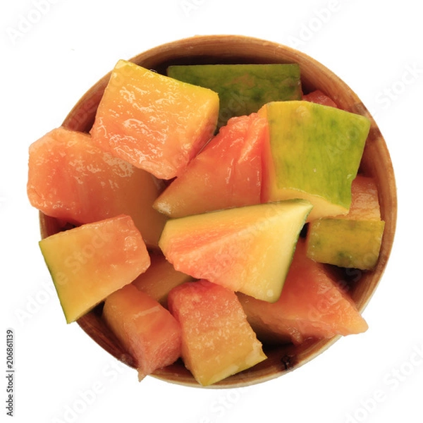 Fototapeta slices of pawpaw in wooden cup  isolated on white background. top view