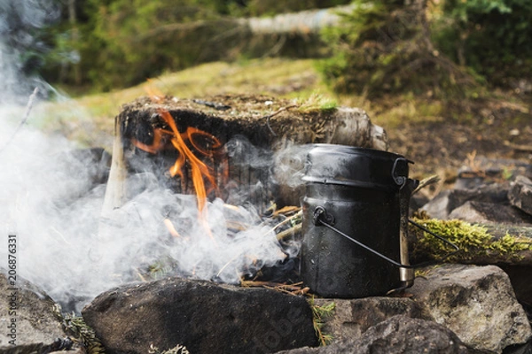 Obraz Cooking on camp fire. Mountains