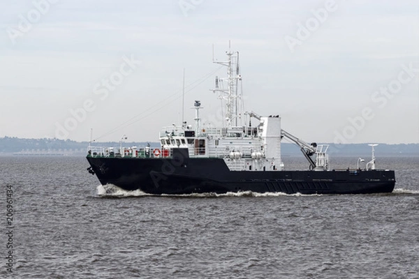 Fototapeta Tugboat on the open sea