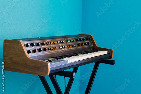 Fototapeta Old synthesizer with colorfull switches on blue background