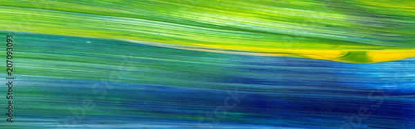 Obraz Abstrakcyjne malarstwo akrylowe do wykorzystania jako tło, tekstura, element projektu. Sztuka współczesna w mieszanych kolorach zielonym, niebieskim, żółtym.