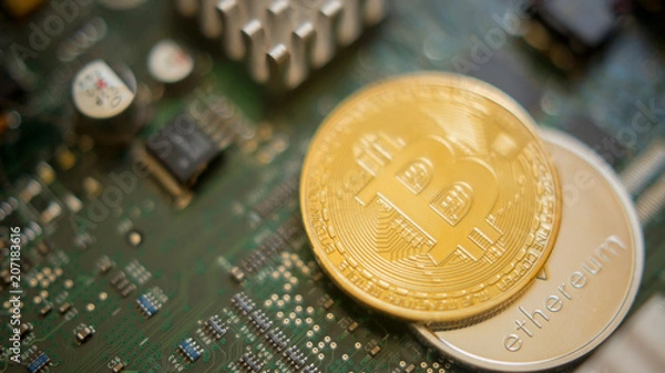 Fototapeta Bitcoin mining process - gold coin on computer circuit board with bitcoin processor and microchips. Electronic currency, internet finance rypto currency concept. Golden Bitcoin Cryptocurrency