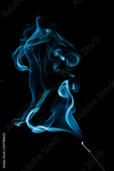 Obraz Abstract blue smoke isolated on black background