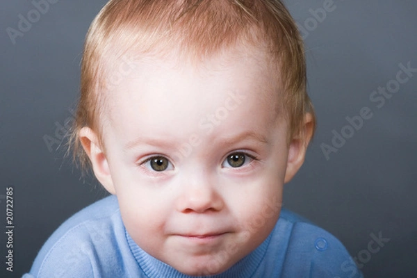 Fototapeta boy looking at camera in studio
