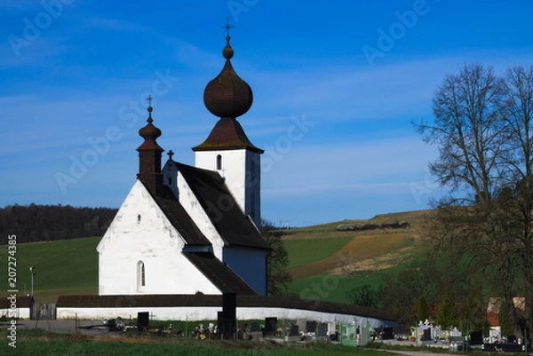 Fototapeta Back view of the church of Žehra in early spring