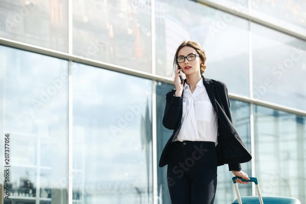Obraz . Business woman at international airport moving to terminal gate for airplane travel trip - Mobility concept and aerospace industry flight connections