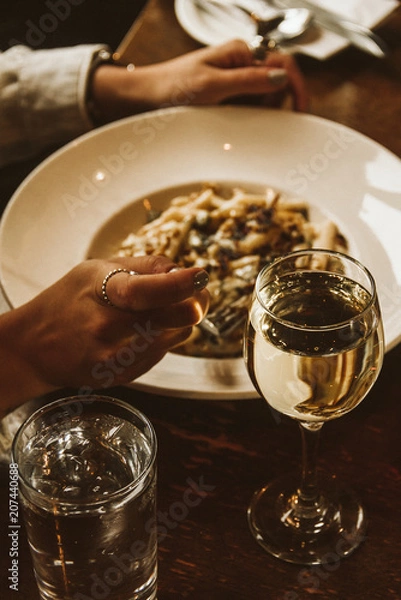 Obraz Person eats a fancy pasta in a nice restaurant 