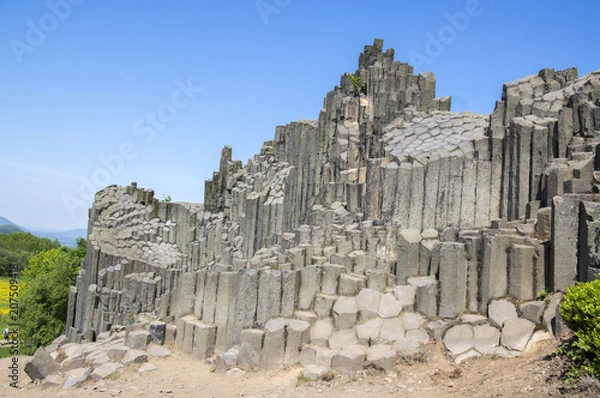 Obraz National Natural Monument named Panska skala, columnar jointed basalt rock in Kamenicky senov village in Czech republic