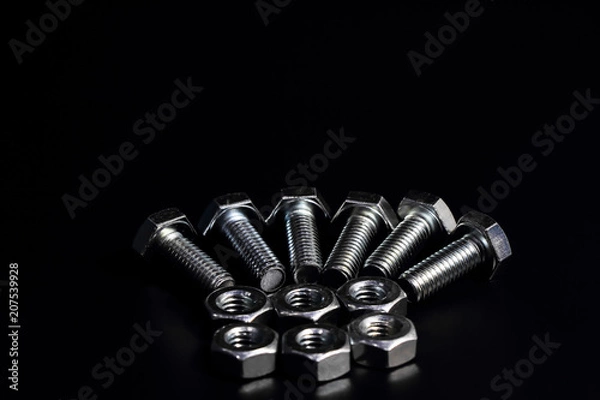 Obraz Screws placed on a black background.1