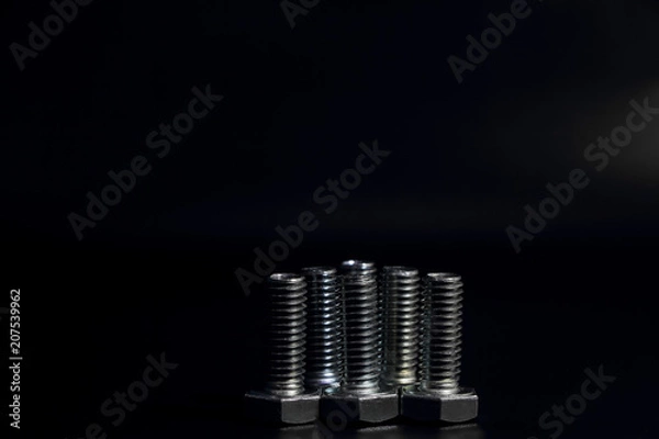 Obraz six screw on black background.