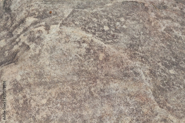 Fototapeta Yellow sand stone texture photo. Natural stone background. Weathered rock relief. Old building stone wall